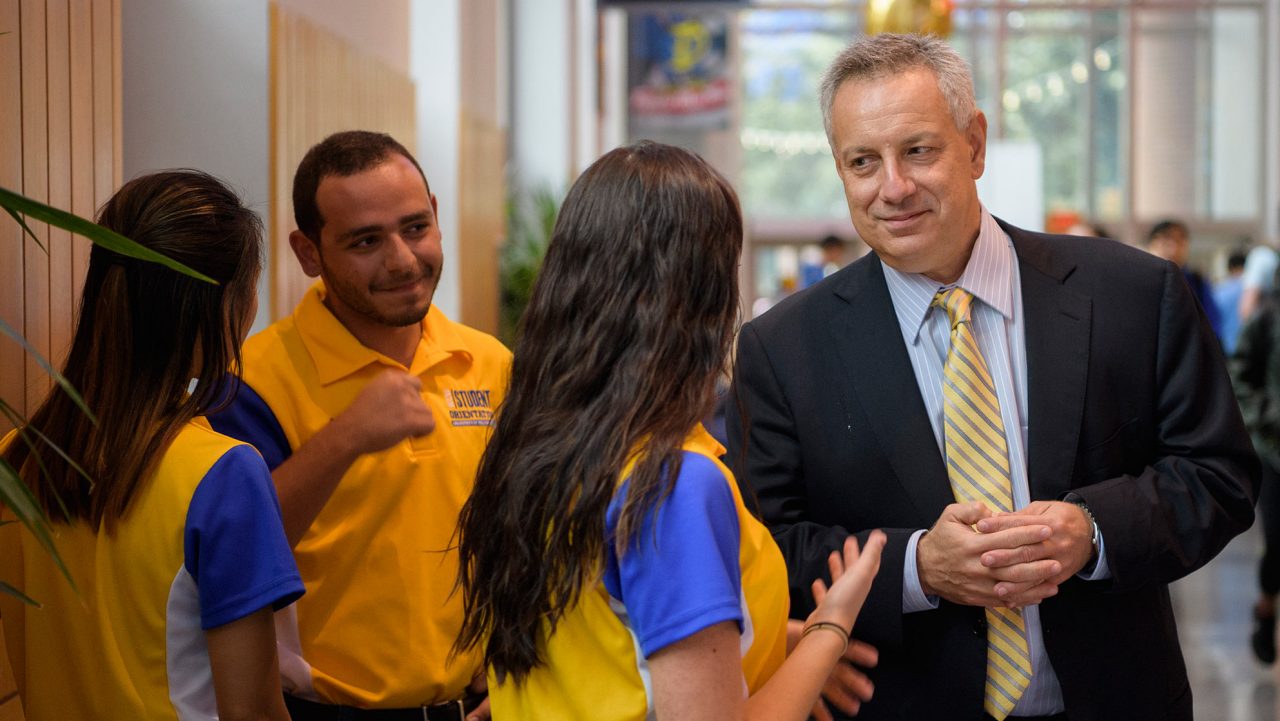 Ask Me Tent - President Dennis Assanis President Assanis speaks with some students during the "Ask Me Tent" event in 2017.